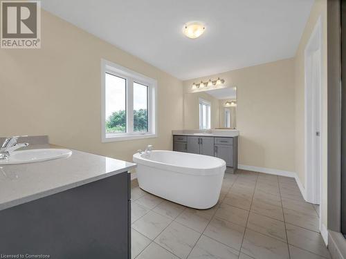 Bathroom with vanity and a bath - 126 Broadacre Drive, Kitchener, ON 