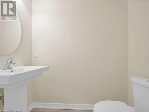 Bathroom with sink, tile patterned flooring, and toilet - 126 Broadacre Drive, Kitchener, ON 