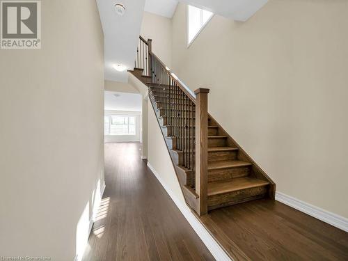 Stairway with a towering ceiling and hardwood / wood-style flooring - 126 Broadacre Drive, Kitchener, ON 