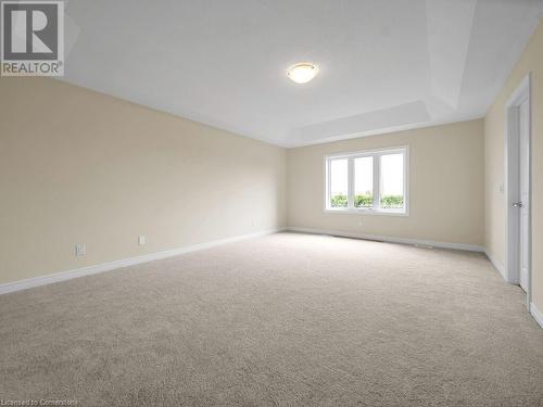 Carpeted spare room featuring a raised ceiling - 126 Broadacre Drive, Kitchener, ON 