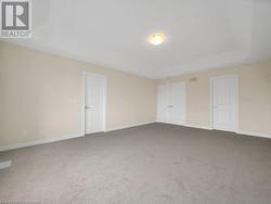 Unfurnished bedroom featuring carpet flooring - 