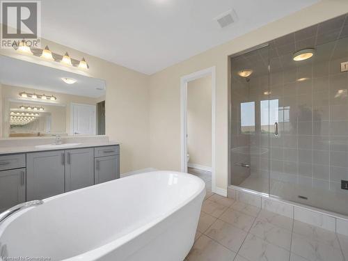 Full bathroom featuring toilet, vanity, and separate shower and tub - 126 Broadacre Drive, Kitchener, ON 