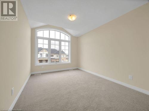 Carpeted spare room with lofted ceiling - 126 Broadacre Drive, Kitchener, ON 