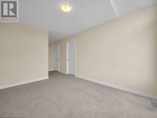 Spare room featuring light colored carpet - 126 Broadacre Drive, Kitchener, ON 