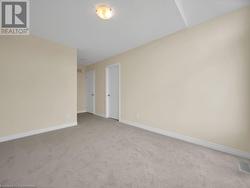 Spare room featuring light colored carpet - 