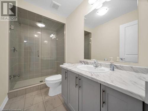 Bathroom featuring a shower with door, vanity, and toilet - 126 Broadacre Drive, Kitchener, ON 