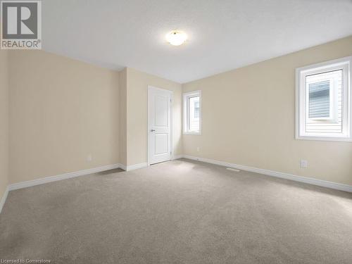 View of carpeted spare room - 126 Broadacre Drive, Kitchener, ON 