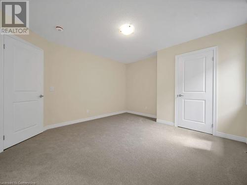 Spare room featuring light colored carpet - 126 Broadacre Drive, Kitchener, ON 