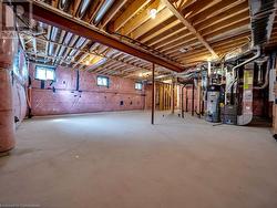 Basement with heating unit and gas water heater - 