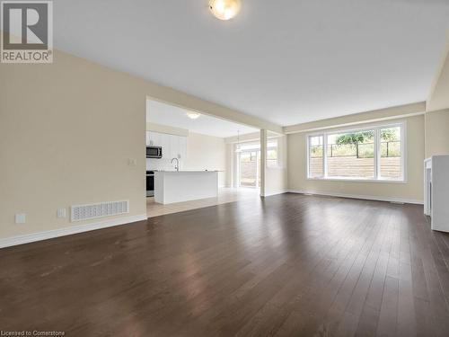 Unfurnished living room with dark hardwood / wood-style floors and sink - 126 Broadacre Drive, Kitchener, ON 