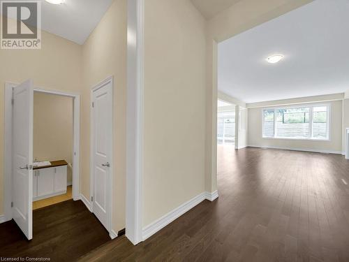 Hallway with dark hardwood / wood-style flooring - 126 Broadacre Drive, Kitchener, ON 