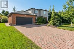 Huge home with Interlock driveway and interlock walkway. Parking for 6, including 2-car garage - 