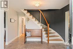 Front foyer featuring high end porcelain tile flooring - 