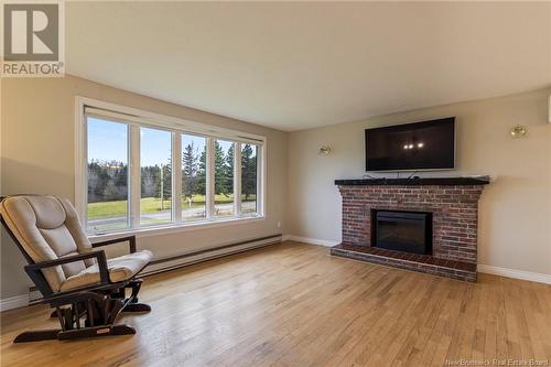 131 Rue Evangeline Street, Bouctouche, NB - Indoor Photo Showing Living Room With Fireplace