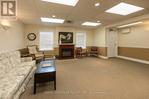 304 - 41 Ash Street, Uxbridge, ON - Indoor Photo Showing Basement With Fireplace