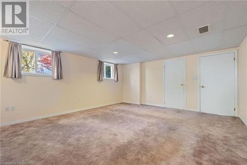 Basement with carpet floors and a drop ceiling - 118 Oak Street, Simcoe, ON 