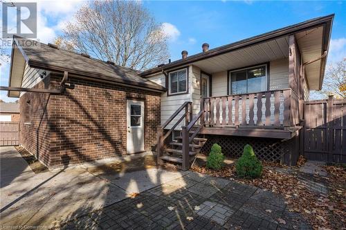 Back of property with a wooden deck - 118 Oak Street, Simcoe, ON 