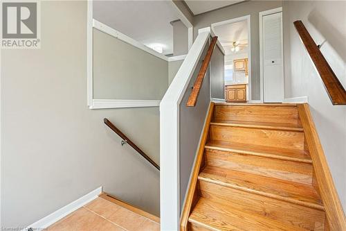 Stairs featuring ceiling fan and tile patterned flooring - 118 Oak Street, Simcoe, ON 