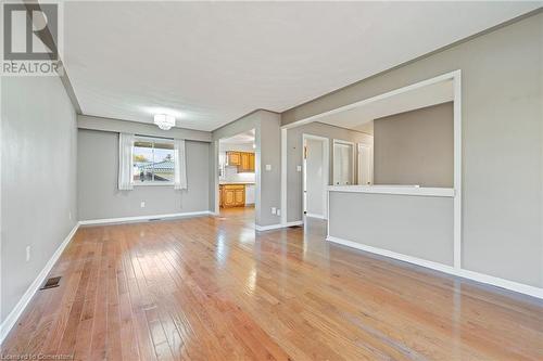 Unfurnished living room featuring light wood-type flooring - 118 Oak Street, Simcoe, ON 