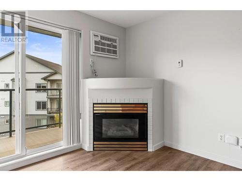 3221 Centennial Drive Unit# 210, Vernon, BC - Indoor Photo Showing Living Room With Fireplace