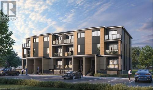 View of building exterior - 246 Raspberry Place Unit# E014, Waterloo, ON - Outdoor With Balcony