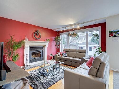 Family room - 3335 Rue Des Orchidées, Longueuil (Saint-Hubert), QC - Indoor Photo Showing Living Room With Fireplace