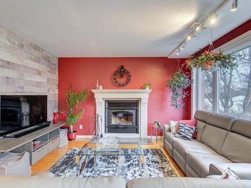 Family room - 3335 Rue Des Orchidées, Longueuil (Saint-Hubert), QC - Indoor Photo Showing Living Room With Fireplace