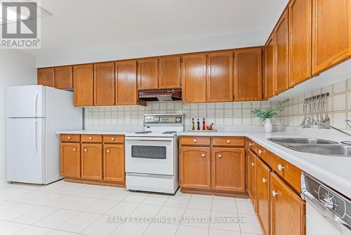 202 - 2175 Marine Drive, Oakville, ON - Indoor Photo Showing Kitchen With Double Sink