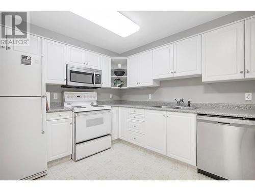 933 Harvey Avenue Unit# 110, Kelowna, BC - Indoor Photo Showing Kitchen With Double Sink