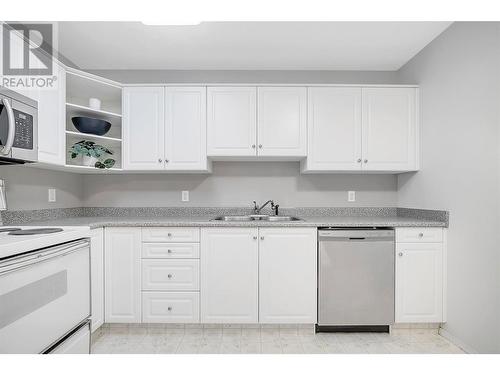 933 Harvey Avenue Unit# 110, Kelowna, BC - Indoor Photo Showing Kitchen With Double Sink