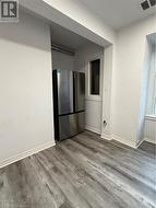 Empty room with hardwood / wood-style flooring - 