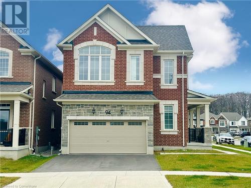 View of front of house with a front lawn and a garage - 94 Milt Schmidt Street, Kitchener, ON - Outdoor With Facade