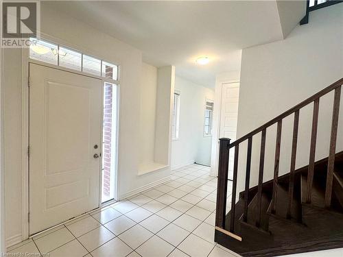 Foyer entrance with light tile patterned floors - 94 Milt Schmidt Street, Kitchener, ON - Indoor Photo Showing Other Room