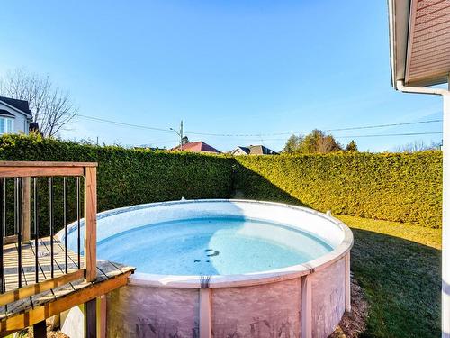 Piscine - 516 Rue Des Cerisiers, Coaticook, QC - Outdoor With Above Ground Pool With Backyard