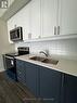 128 - 8175 Britannia Road, Milton, ON  - Indoor Photo Showing Kitchen With Double Sink 