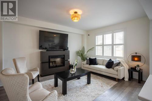 103 Kay Crescent, Centre Wellington, ON - Indoor Photo Showing Living Room With Fireplace