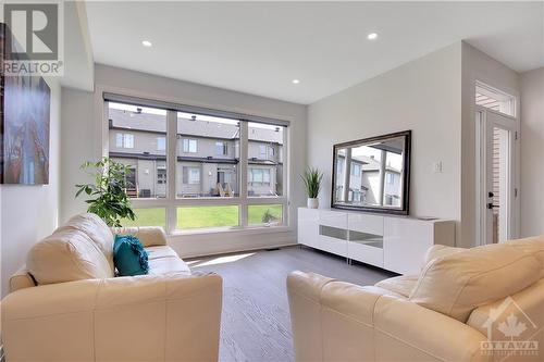 Formal Living Room adorn with a large Window - 721 Capricorn Circle, Ottawa, ON - Indoor Photo Showing Living Room