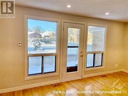 Lots of  windows looking out to the yard and grass beyond. - 