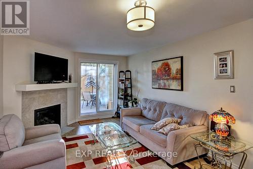 111 - 733 Deveron Crescent, London, ON - Indoor Photo Showing Living Room With Fireplace