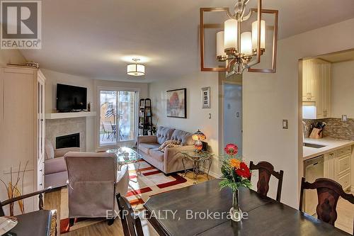 111 - 733 Deveron Crescent, London, ON - Indoor Photo Showing Dining Room With Fireplace