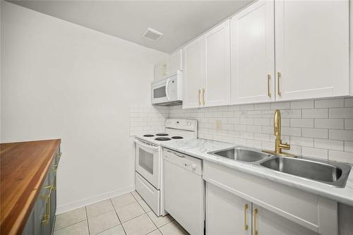 110 70 Maryland Street, Winnipeg, MB - Indoor Photo Showing Kitchen With Double Sink