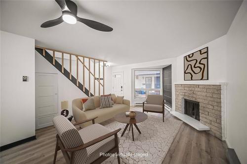 110 70 Maryland Street, Winnipeg, MB - Indoor Photo Showing Living Room With Fireplace