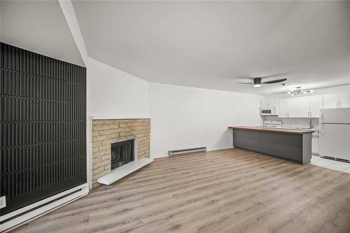 110 70 Maryland Street, Winnipeg, MB - Indoor With Fireplace