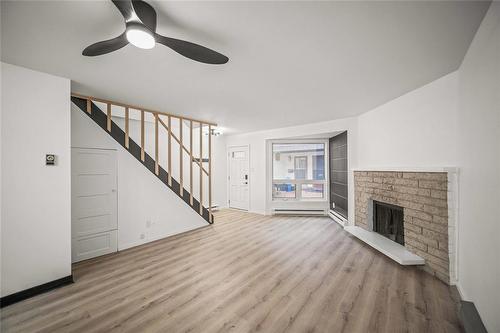 110 70 Maryland Street, Winnipeg, MB - Indoor With Fireplace