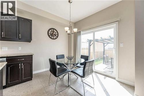 Tiled dining space with an inviting chandelier - 243 Greenwater Place Unit# Upper, Kitchener, ON - Indoor Photo Showing Other Room