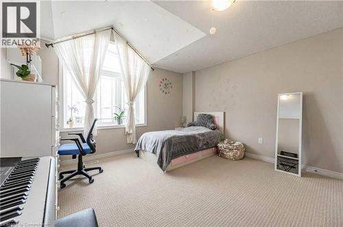 Carpeted bedroom with lofted ceiling - 243 Greenwater Place Unit# Upper, Kitchener, ON - Indoor Photo Showing Bedroom