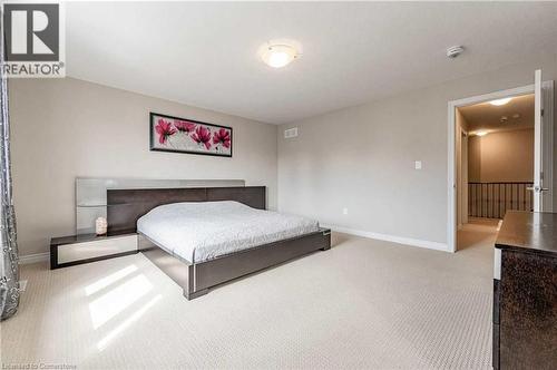 Bedroom featuring light carpet - 243 Greenwater Place Unit# Upper, Kitchener, ON - Indoor Photo Showing Bedroom