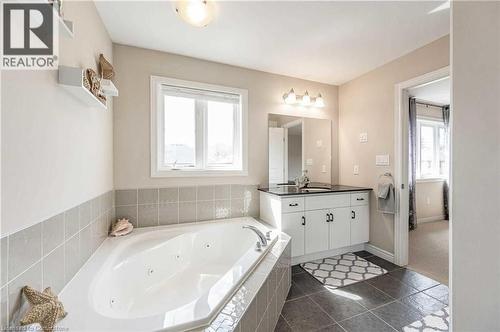 Bathroom with tile patterned floors, vanity, and tiled tub - 243 Greenwater Place Unit# Upper, Kitchener, ON - Indoor Photo Showing Bathroom