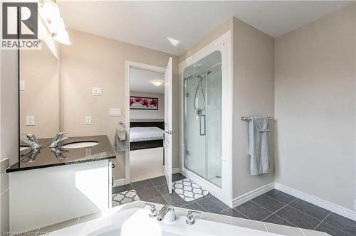 Bathroom featuring tile patterned floors, vanity, and a shower with door - 243 Greenwater Place Unit# Upper, Kitchener, ON - Indoor Photo Showing Other Room