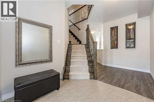 Stairs featuring decorative columns and hardwood / wood-style floors - 243 Greenwater Place Unit# Upper, Kitchener, ON - Indoor Photo Showing Other Room